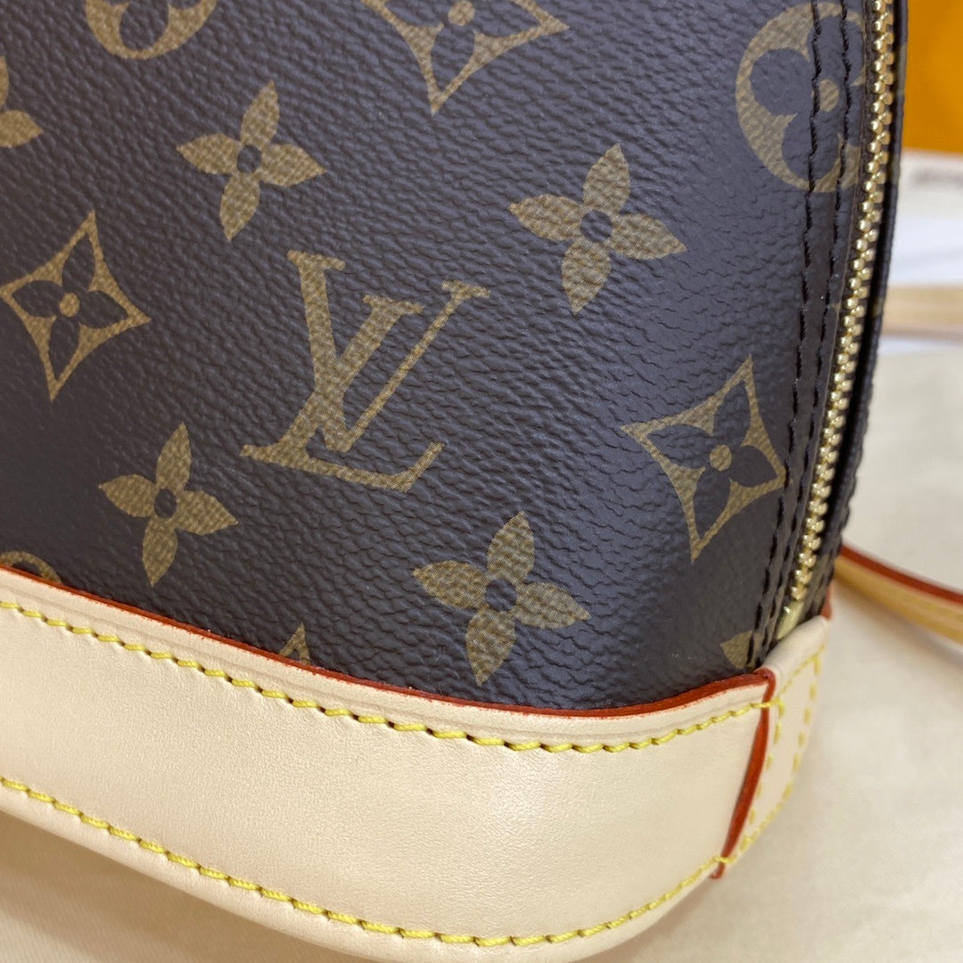 Louis Vuitton Alma Shell Handbag