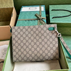 Gucci GG Supreme Clutch with GG Detail