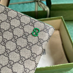 Gucci GG Supreme Clutch with GG Detail