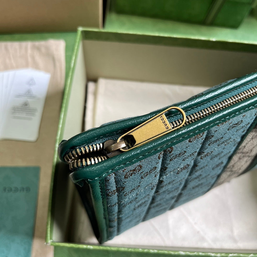 Gucci Mini GG Canvas Clutch