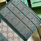Gucci Mini GG Canvas Clutch