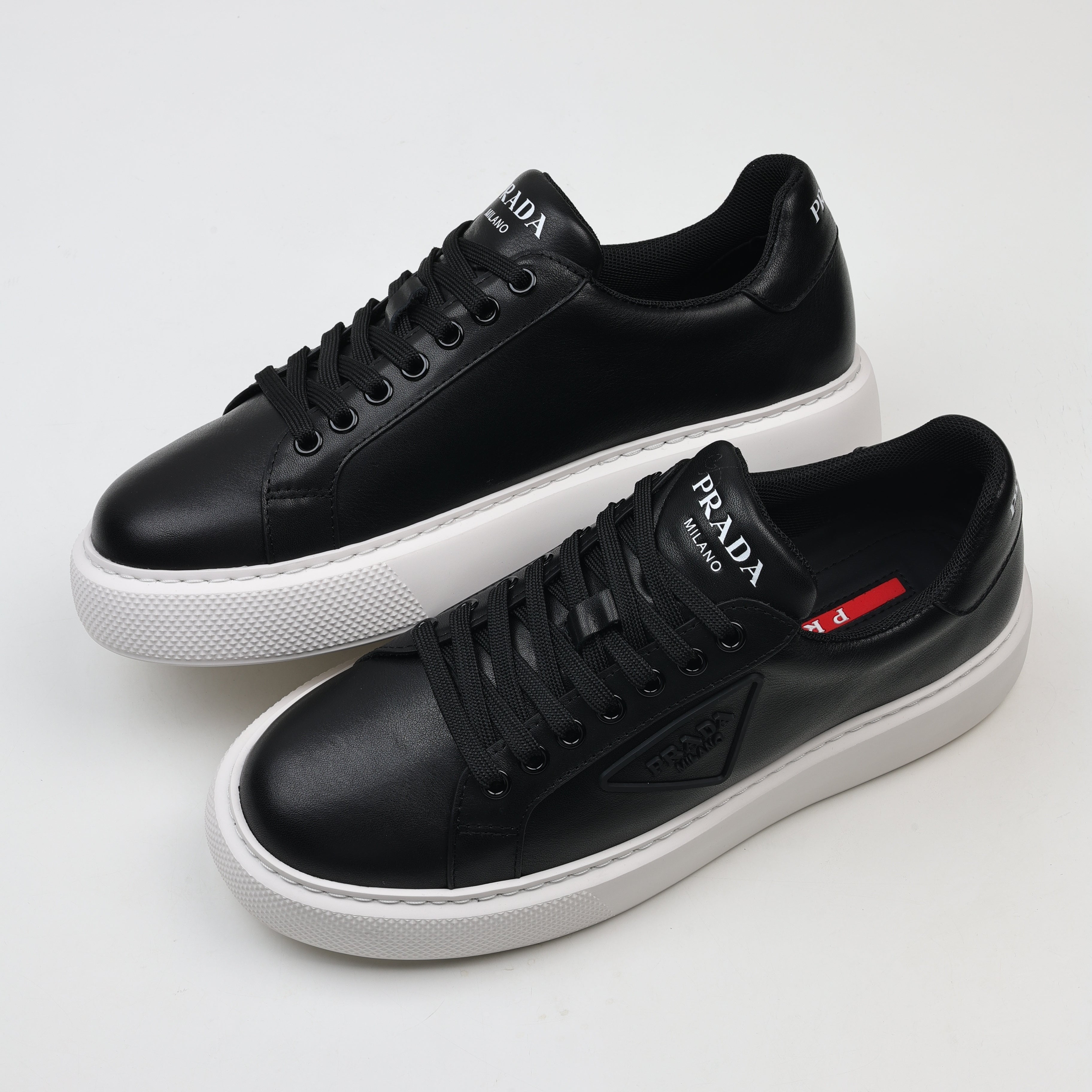 Prada Leather Platform Low-Top Sneakers