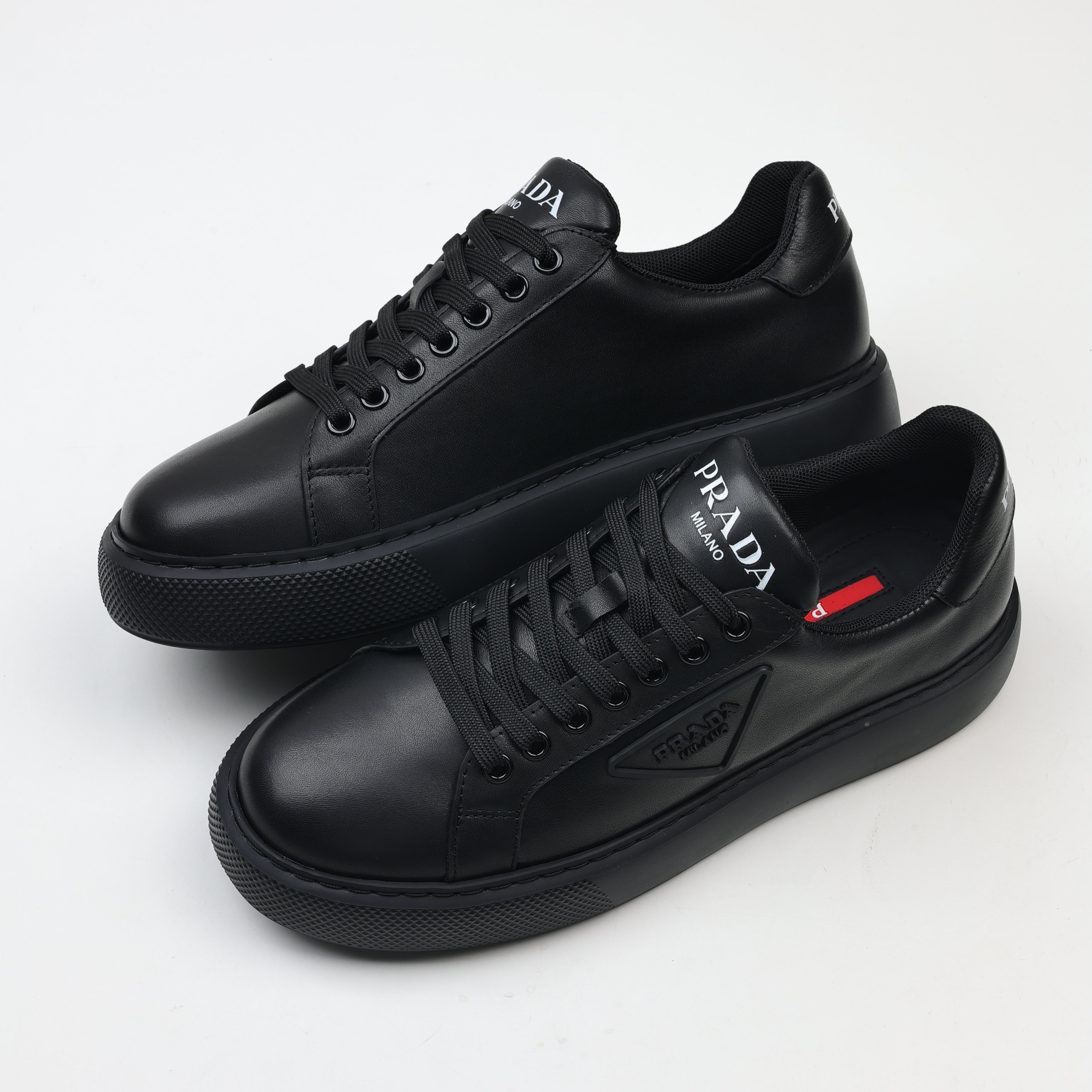 Prada Leather Platform Low-Top Sneakers