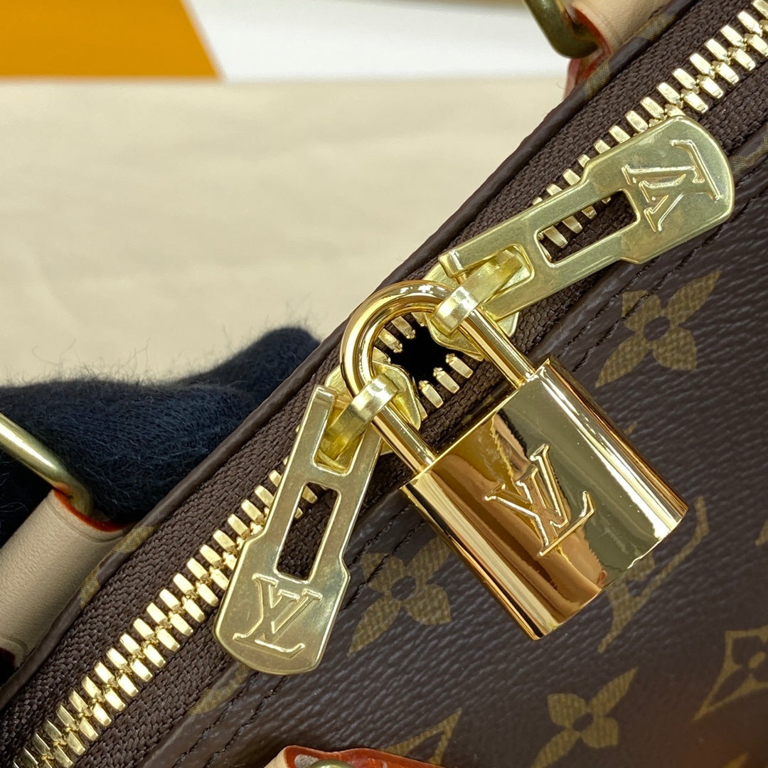 Louis Vuitton Alma Shell Handbag