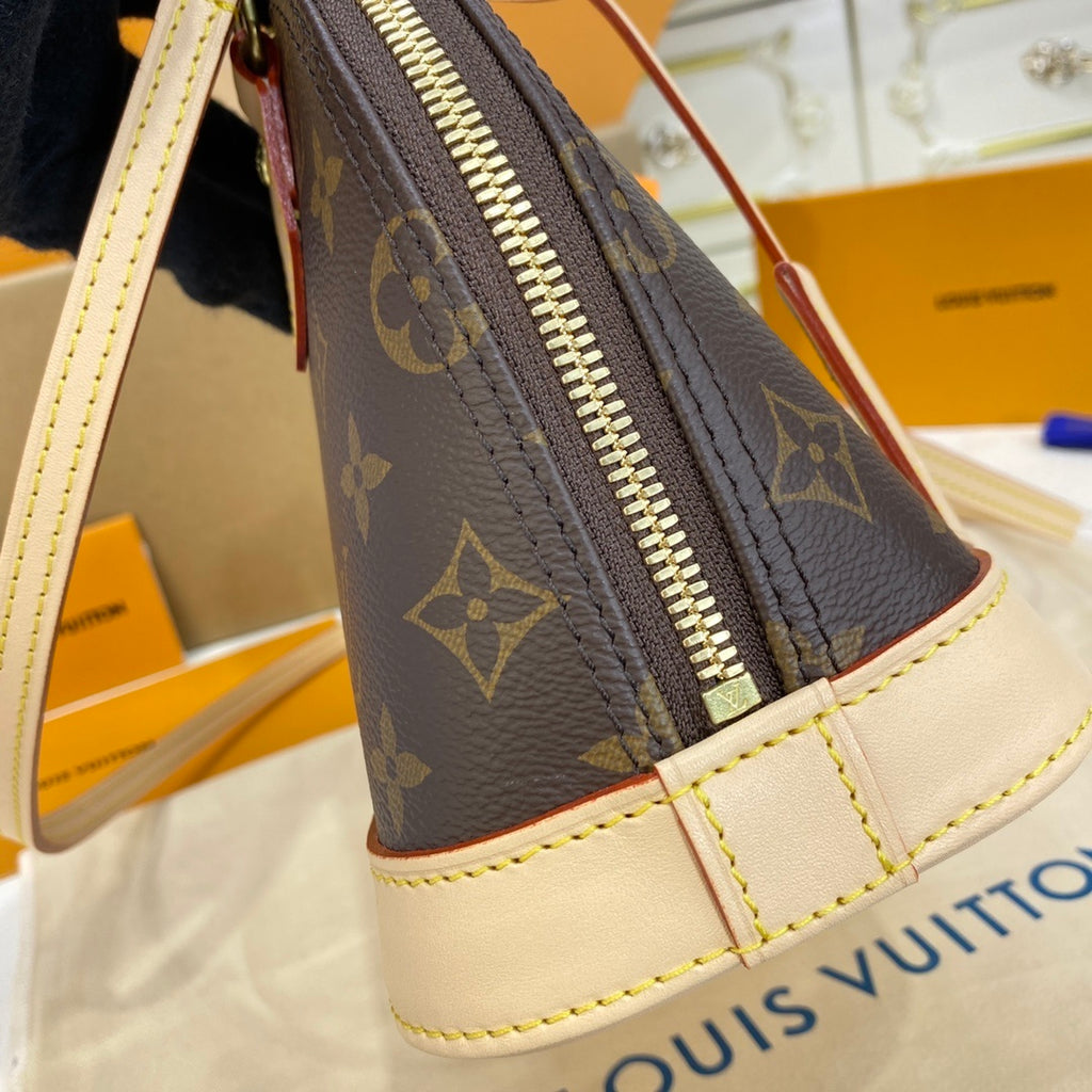 Louis Vuitton Alma Shell Handbag